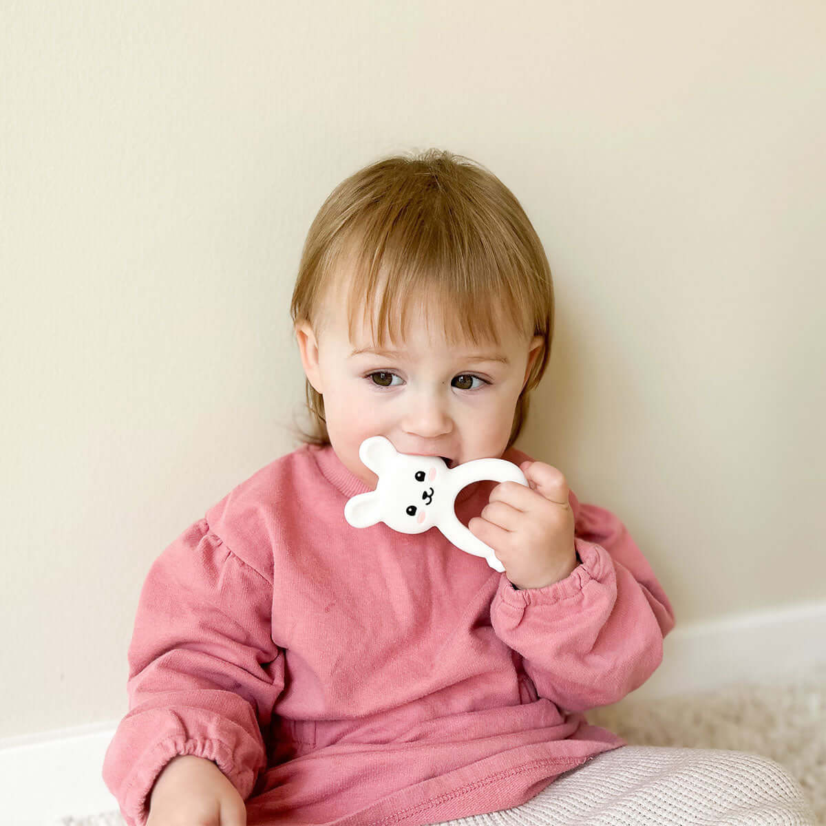 Baby chewing MomMed Silicone Baby Teether rabbit toy