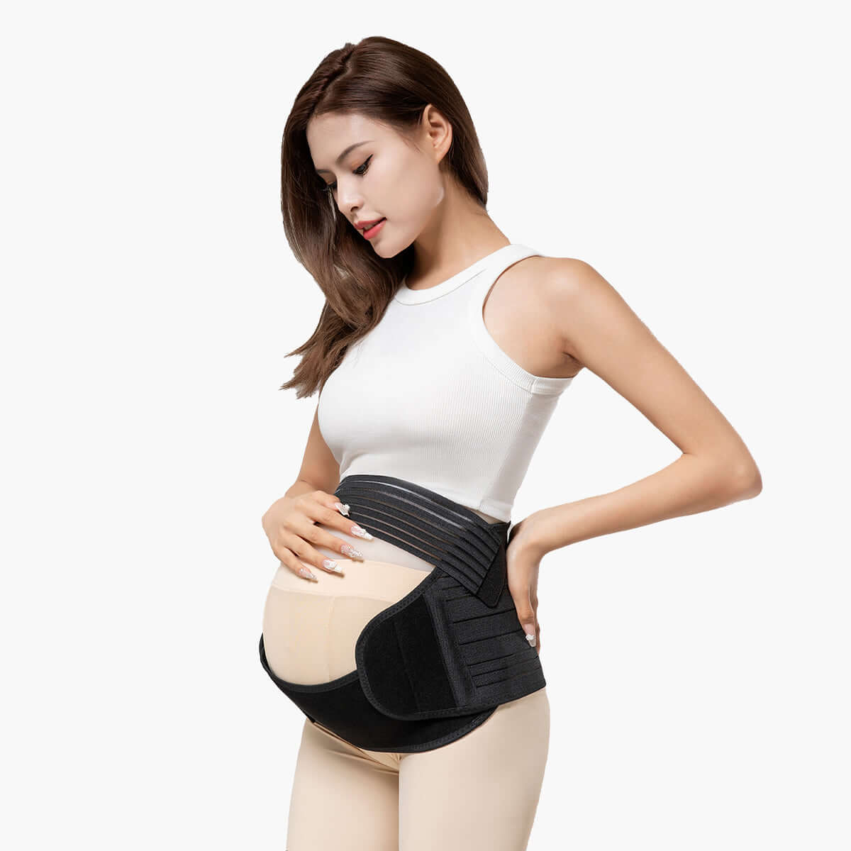 A pregnant woman using the MomMed Maternity Belly Band