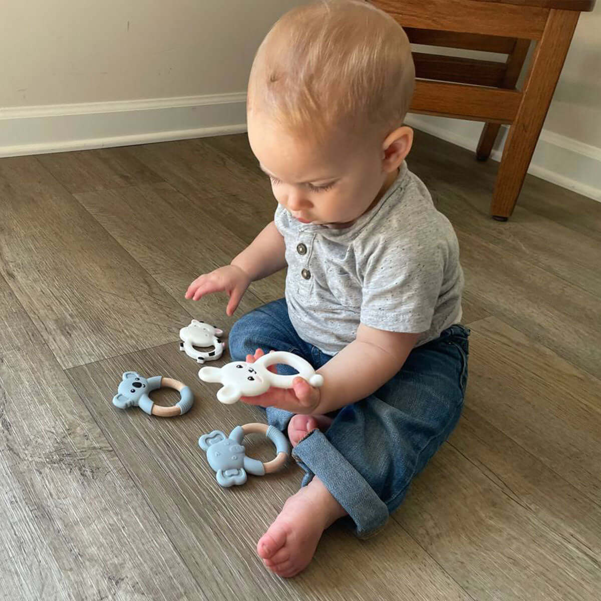 Baby playing with MomMed Silicone Baby Teether Toys