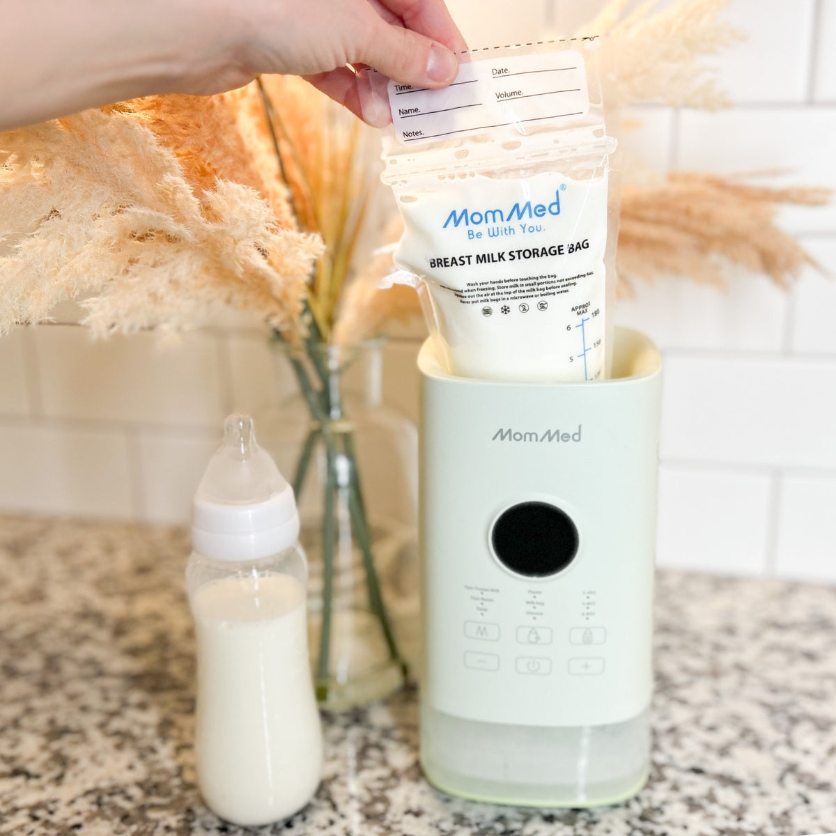 Removing milk from the MomMed baby bottle warmer