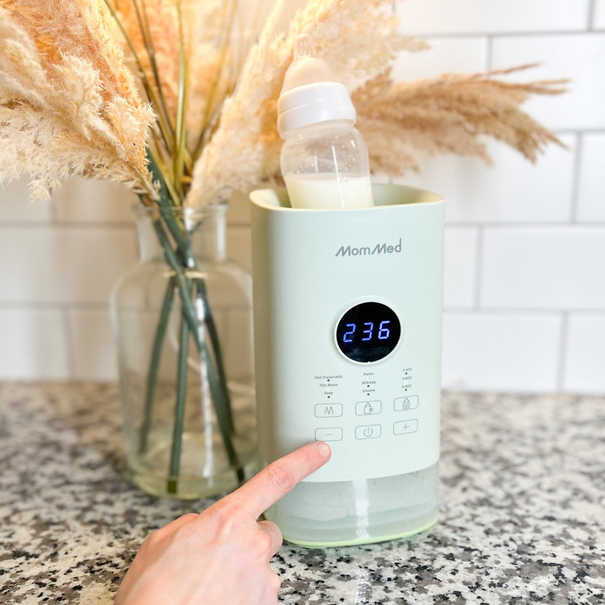 Prepare to warm milk in the MomMed baby bottle warmer