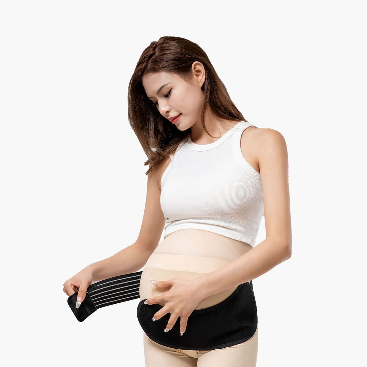 A pregnant woman wearing the MomMed maternity belly band