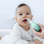Mother preparing her baby for use with the MomMed Baby Nasal Aspirator